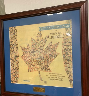 Lot # 6.9 Framed front page of The Toronto Star. Headline: “Happy Birthday Canada!”