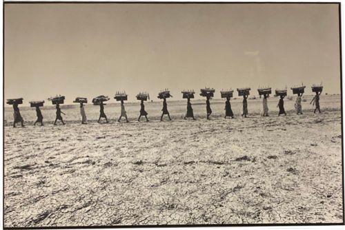 Image for Lot # 25.1 1991 Sudan – Photographer Andrew Stawicki Bearing water from afar women carrying water from Nile River to theirs homes for some the trip would take between one and three hours -