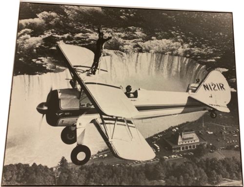 Image for Lot # 25.11 Undated, Daredevil stands on plane flying over Niagara Falls