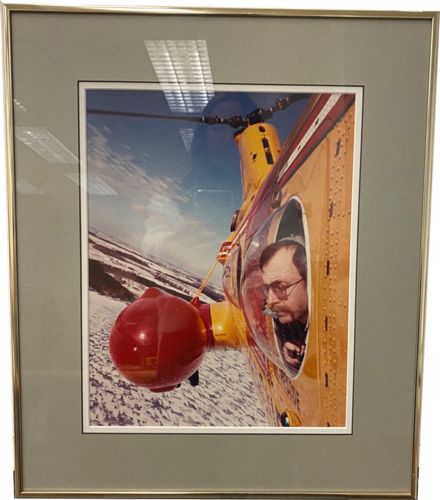 Lot #29.0 Photo by Record Photographer - Person looking out over snowy acres from helicopter