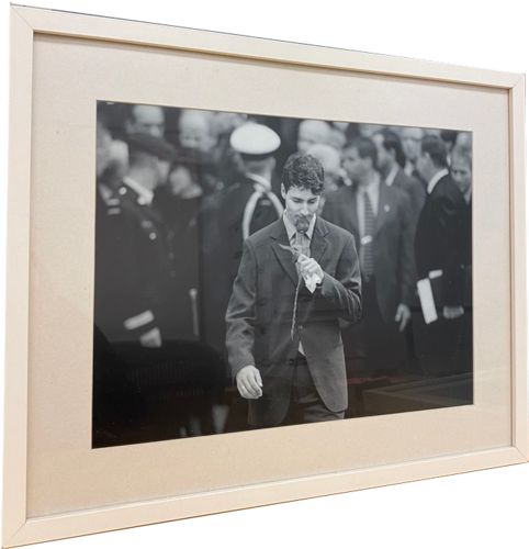 Lot # 43.6 Framed photograph of young Trudeau smelling a rose