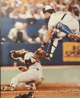 Image for Lot #8.6 “Bordering on Spectacular. Dan Gladden slides into home just past Pat Borders during A.L.C.S.” Photographed by Colin McConnell 1991