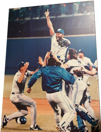 Lot #8.24 Joe Carter celebrating World Series